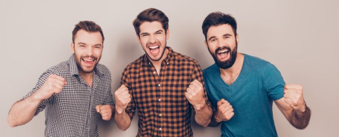 YEAH! three handsome screaming men showing their strong hands