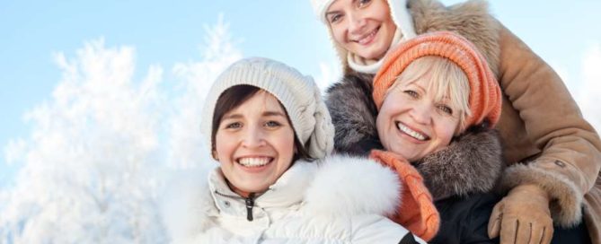Woman in cold weather clothes smiling