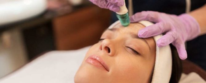 Woman receiving microdermabrasion treatment