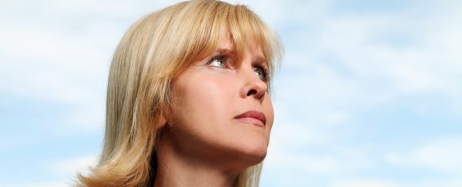 Woman looking off into the distance.