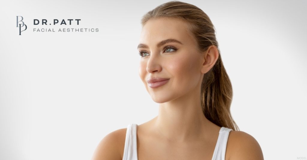 Woman's profile representing rhinoplasty and liquid rhinoplasty treatment options (model)