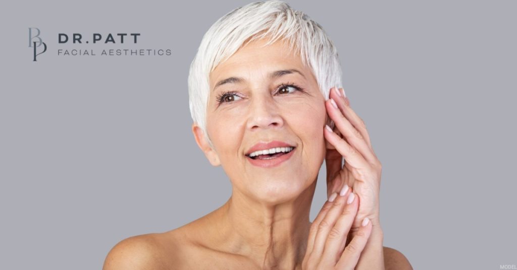 Youthful looking woman after facial plastic surgery. (Model)