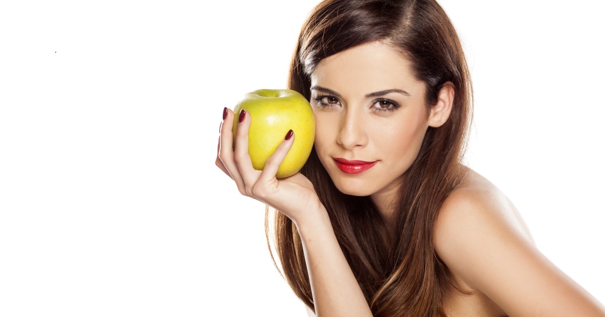 Woman-holding-apple